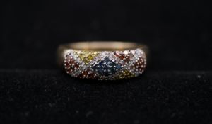 A 9 carat yellow gold and coloured diamond half eternity ring. Set to centre with nine round