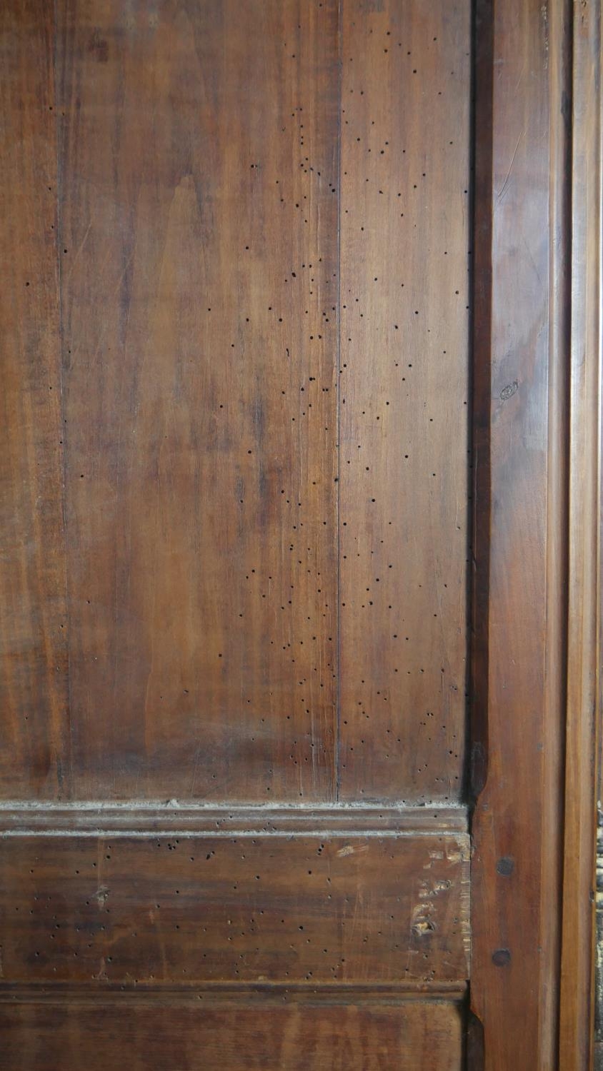 A 19th century carved chestnut French armoire. H.218 W.129 D.59cm (extensive woodworm damage and - Image 18 of 40