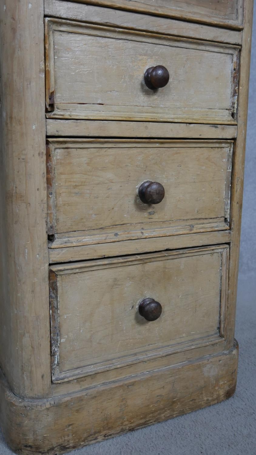 A Victorian pine kneehole desk with an arrangement of nine drawers on plinth base. H.76.5 W.120 D. - Image 5 of 9