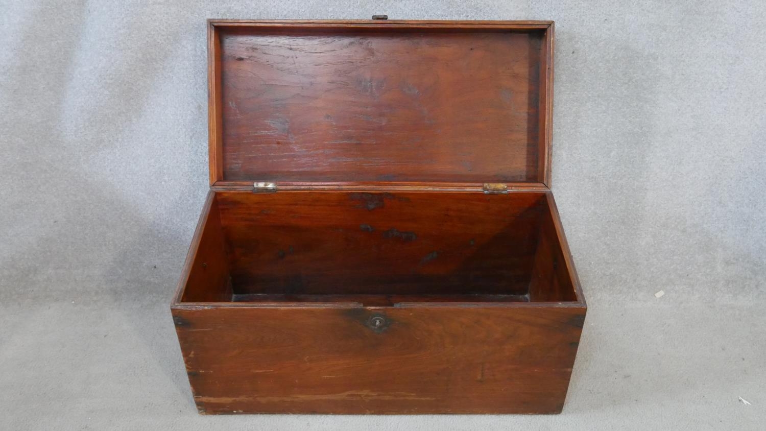 A 19th century camphor hinged lidded travelling trunk with twin iron carrying handles. H.40 W.77 D. - Image 3 of 7