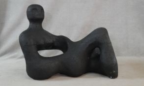 A painted polystyrene sculpture depicting an abstract lying figure. H.88 L.120 W.60cm