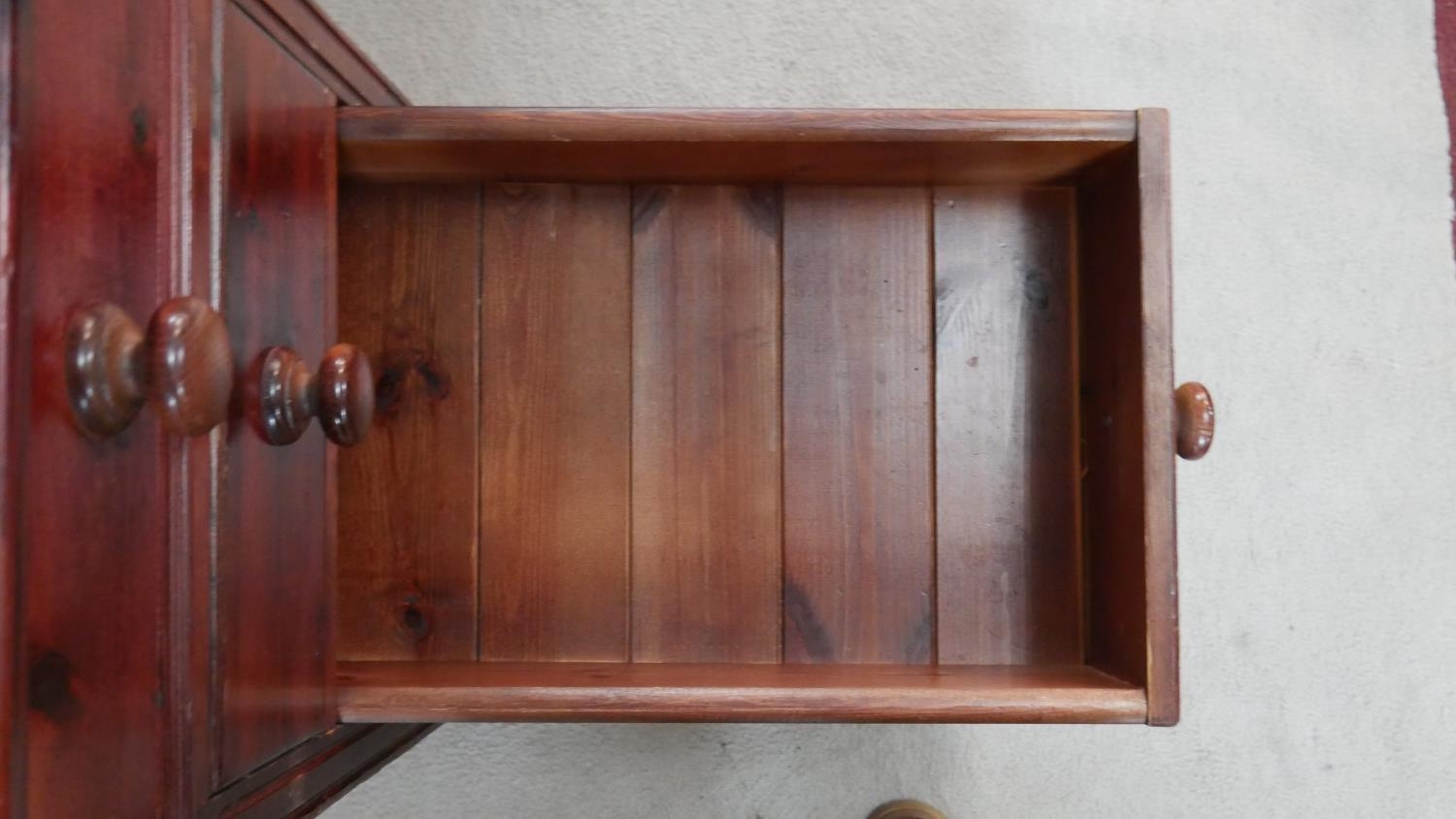 A Victorian style stained pine pedestal desk with an arrangement of nine drawers on shaped plinth - Image 3 of 5