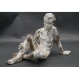 A plaster figure on wirework frame, bronzed and patinated effect, seated figure. H.22cm