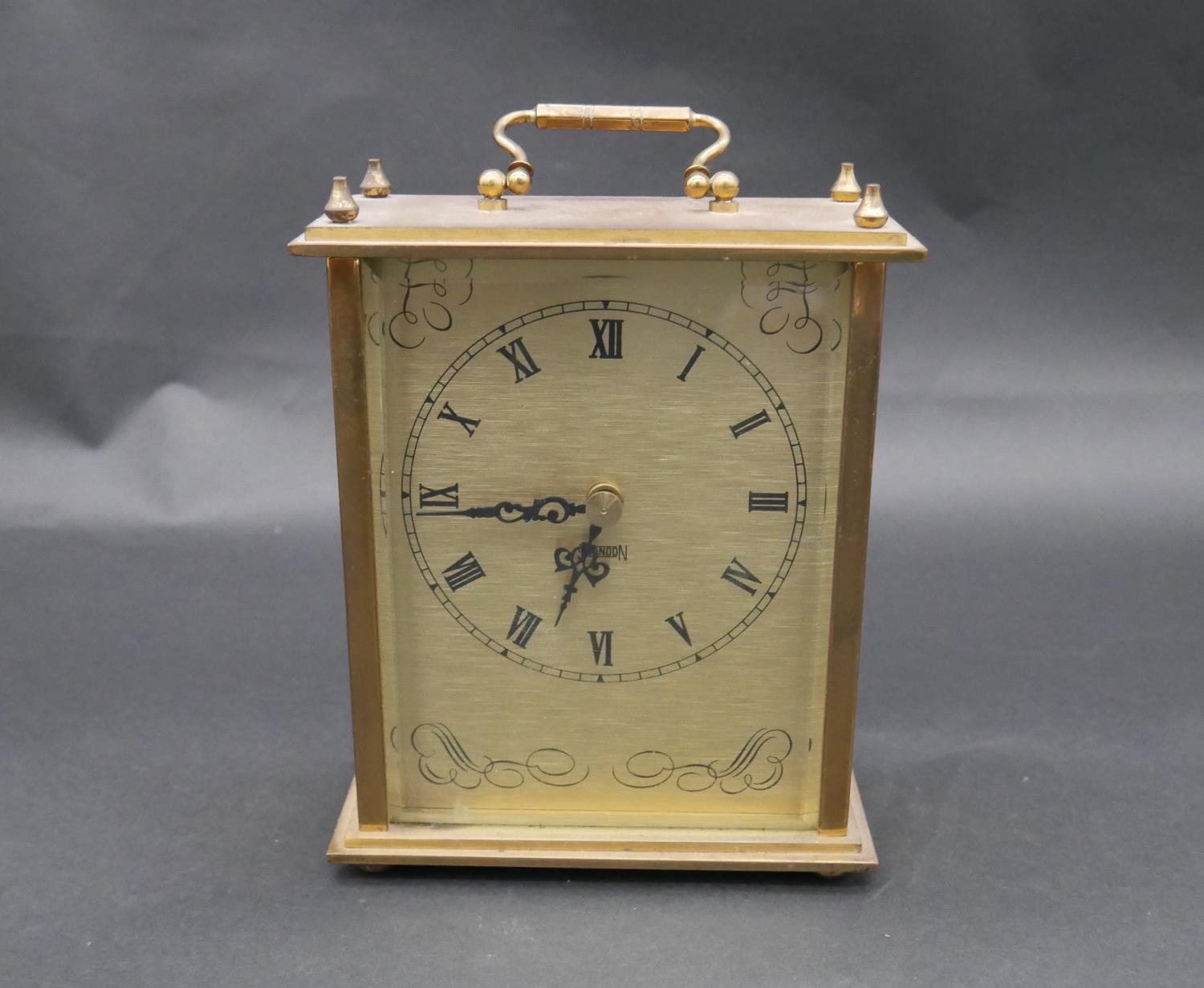 A vintage brass cased hourglass and a battery powered brass mantel clock with carrying handle. H. - Image 2 of 8