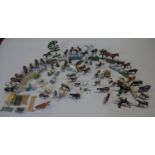 An extensive collection of vintage painted lead farmyard and sporting animals and people, around 100