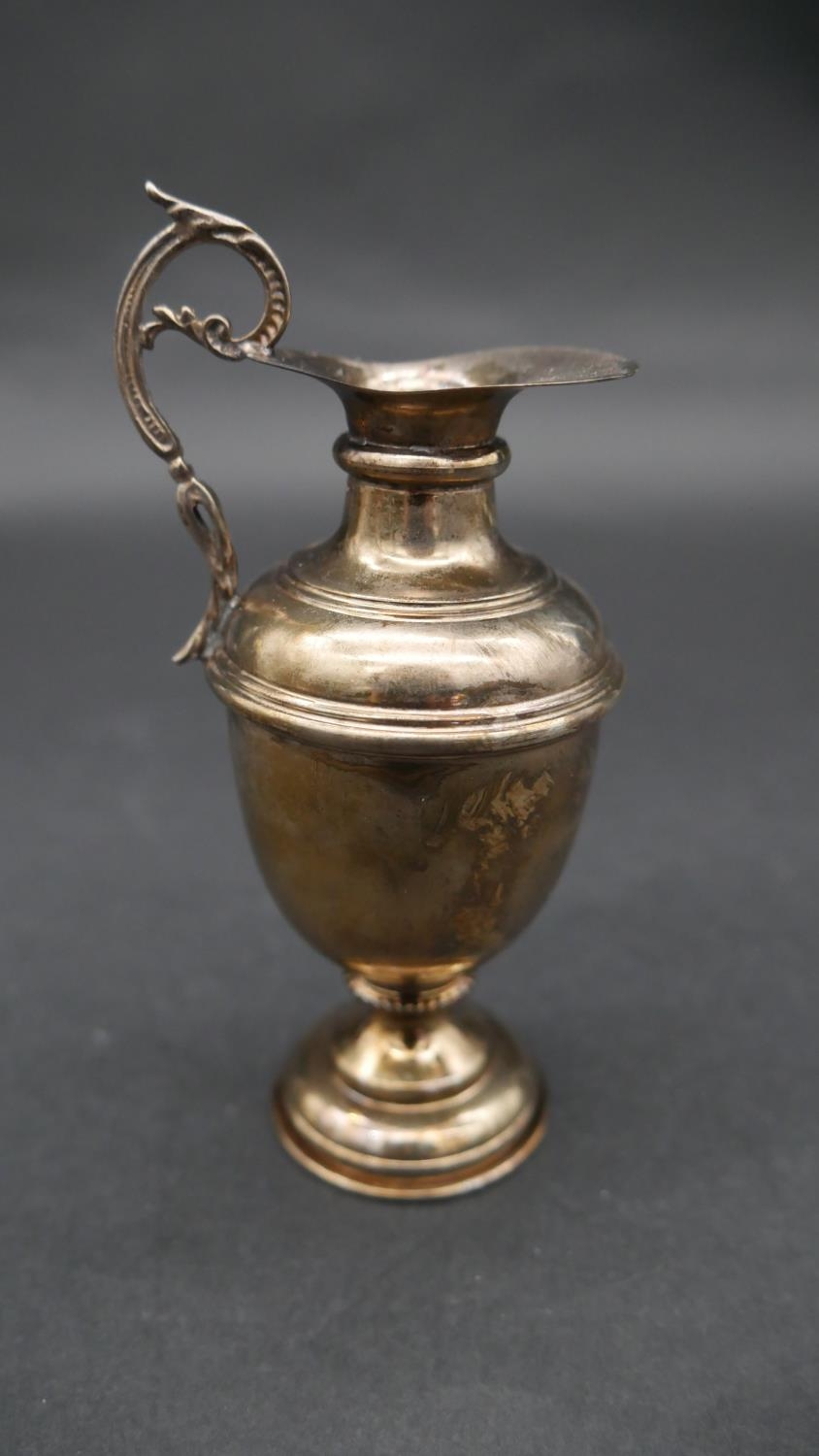 A collection of silver items. Including A miniature silver Grecian style water pitcher, a repousse - Image 2 of 9