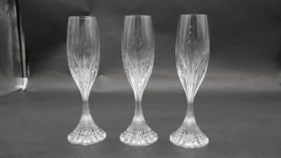Three Baccarat 'Massena' design cut crystal champagne flutes. Makers stamp to the base. H.21.5cm