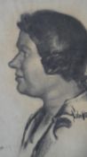 A framed and glazed charcoal drawing, profile portrait, signed John Vickery. H.42.5 W.33cm