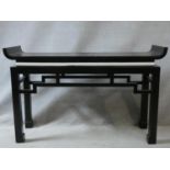 A contemporary Chinese style console table with tray top above pierced frieze on square supports.