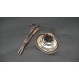 A sterling silver wine funnel and a pair of silver grape scissors with vine relief decoration.