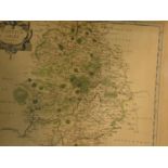 A framed and glazed Antiquarian map of Warwickshire engraved by Robert Morden with later hand