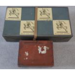 A vintage cardboard lidded White Knight Laundry box with leather strap and labels along with a