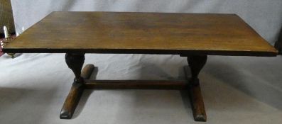 An antique country oak refectory planked top dining table on carved bulbous supports on