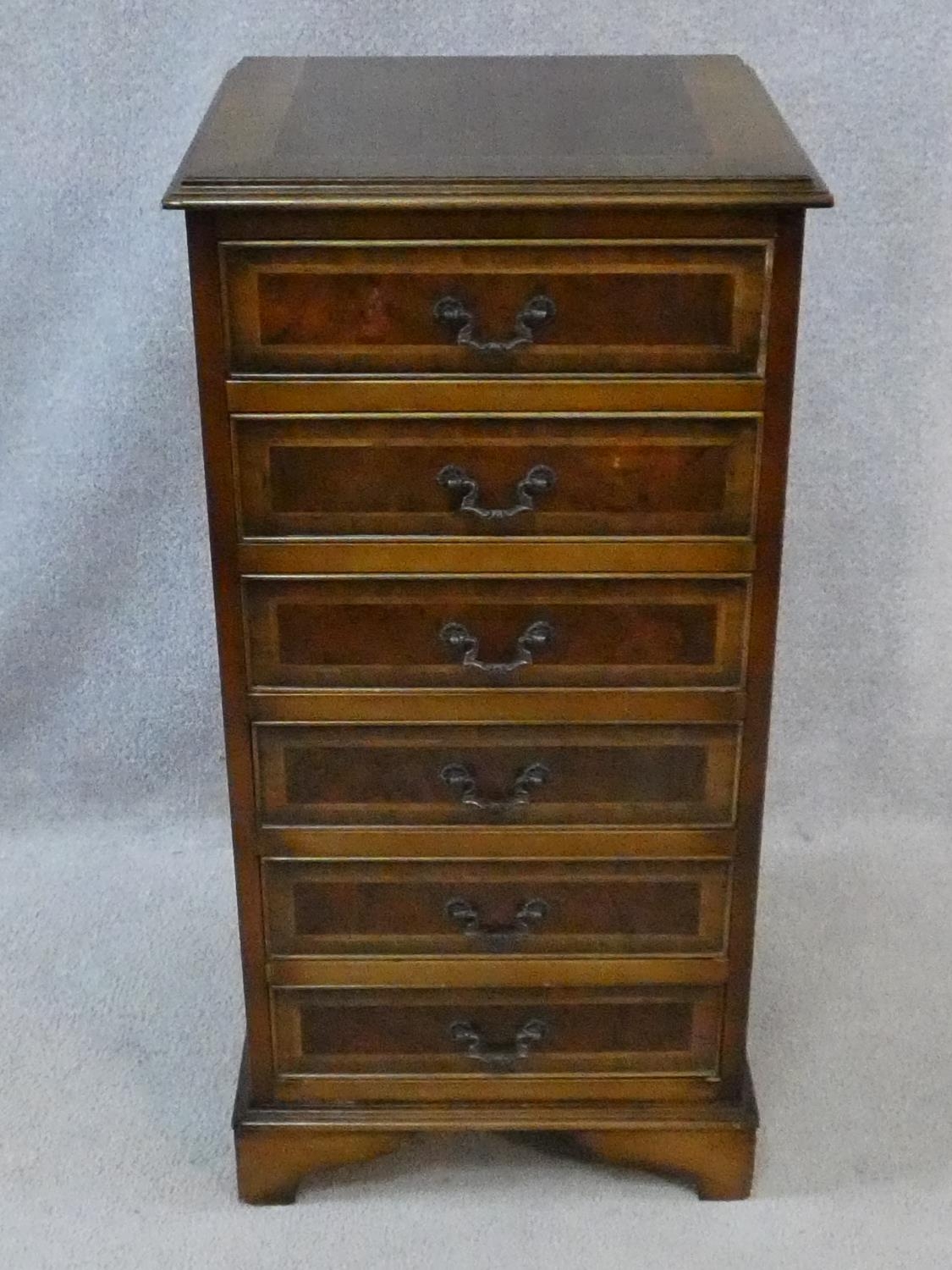 A Georgian style burr walnut and crossbanded small chest of six drawers on bracket feet. H.88 W.44