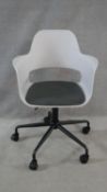 A contemporary retro styled swivel office desk armchair. H.96cm