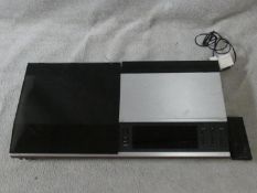 A Bang & Olufsen Beocenter 7007 with power cables and remote control. H.9 W.38 D.72cm