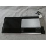 A Bang & Olufsen Beocenter 7007 with power cables and remote control. H.9 W.38 D.72cm