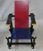 A modern 635 Red and Blue Lounge Chair designed by Gerrit Thomas Rietveld with stained yellow and