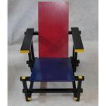 A modern 635 Red and Blue Lounge Chair designed by Gerrit Thomas Rietveld with stained yellow and