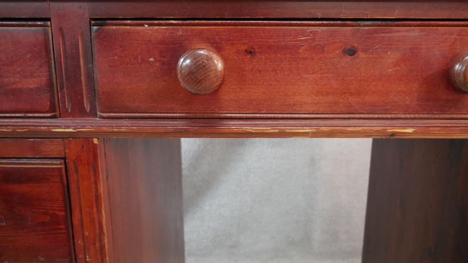 A Victorian style stained pine pedestal desk with an arrangement of nine drawers on shaped plinth - Image 5 of 5