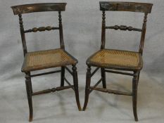 A pair of Regency faux rosewood bedroom chairs each with complementary carved back rails on ring