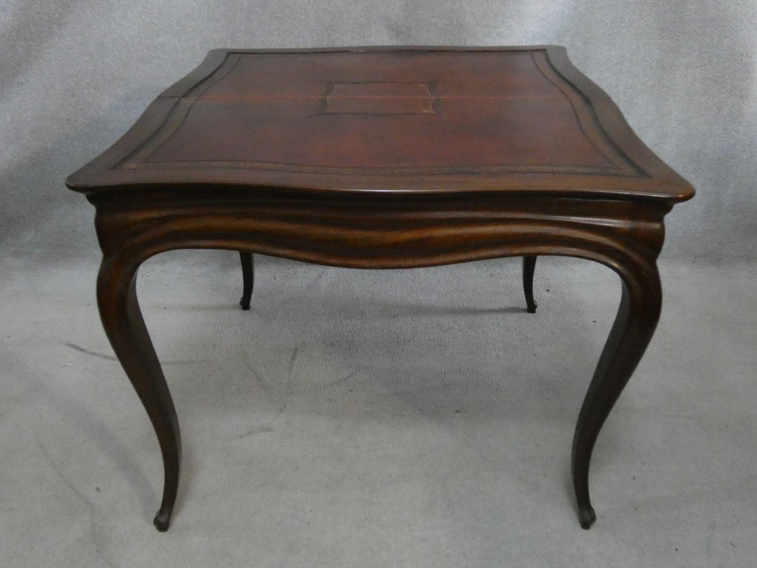 An antique mahogany Louis XV style fold over top card table with tooled leather inset top and pull - Image 3 of 8