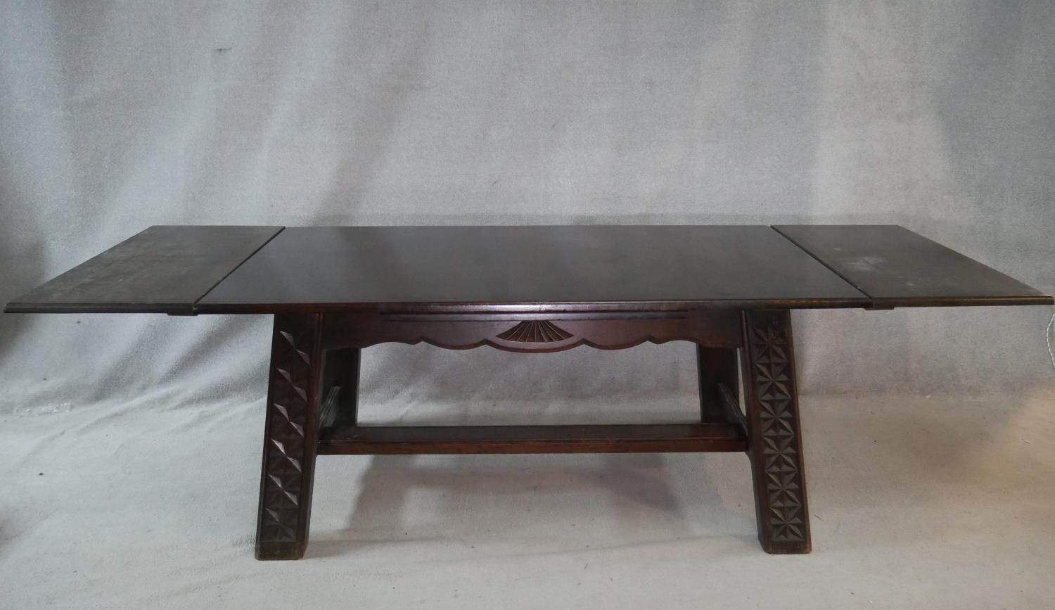 A vintage oak draw leaf dining table on carved square stretchered and pegged supports. H.76 L.267 - Image 2 of 6