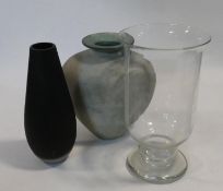 Three large glass vases. One John Lewis frosted black glass with faceted design, a clear glass