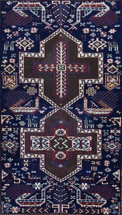 A fine Kazak style rug with double central medallions on indigo field with stylised animal and - Image 2 of 3