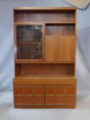 A McIntosh mid century vintage teak display cabinet with escritoire section and fitted with