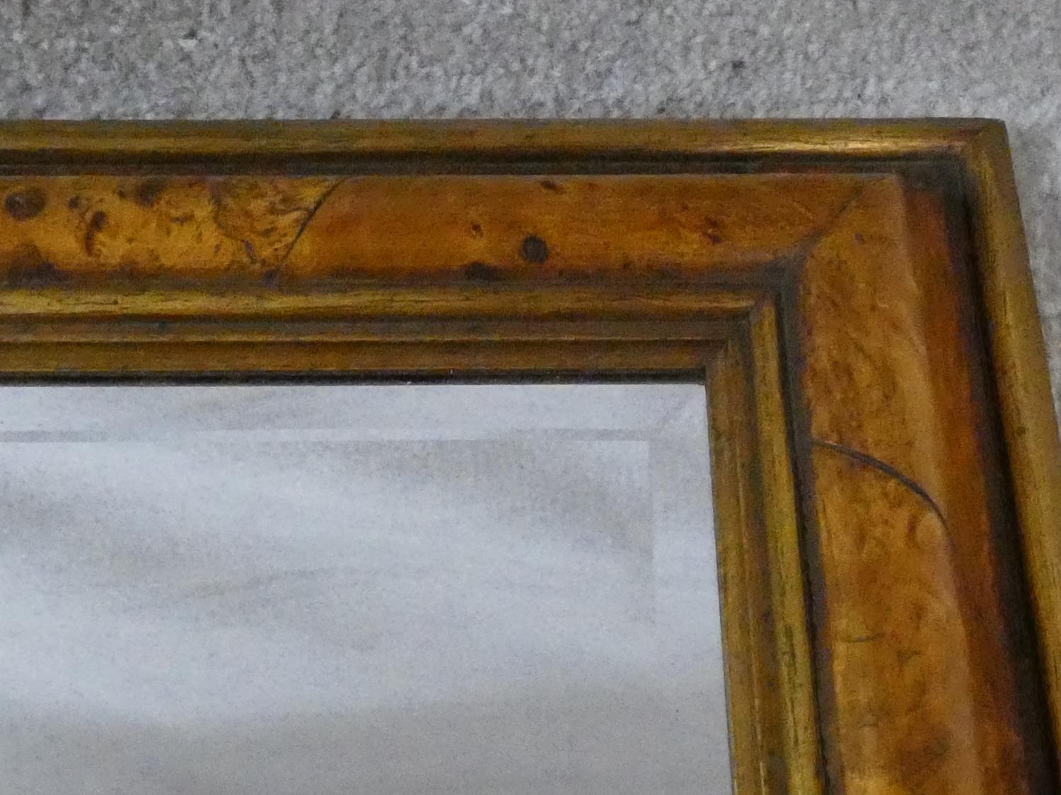 A bevelled wall mirror in burr elm moulded frame. H.58 W.48cm - Image 3 of 5