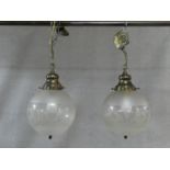 A pair of etched and frosted glass ceiling light pendants of globular shape. H.42 D.50cm