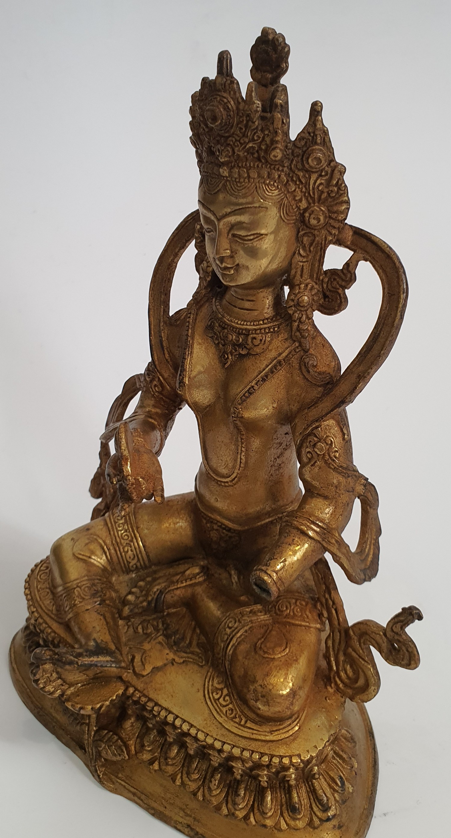 A 19th Tibetan century gilded bronze Buddha sitting on a lotus flower base. H.23xW.15cm - Image 2 of 3