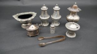 A miscellaneous collection of silver plated table items, salt, mustard pot, shakers etc. H.12cm
