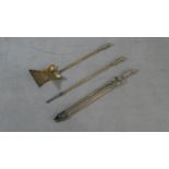 A set of 19th century embossed brass fire irons. L.71.5cm