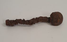 A Chinese carved rootwood brush rest, possibly Huanghuali. Carved with figures, flowers and