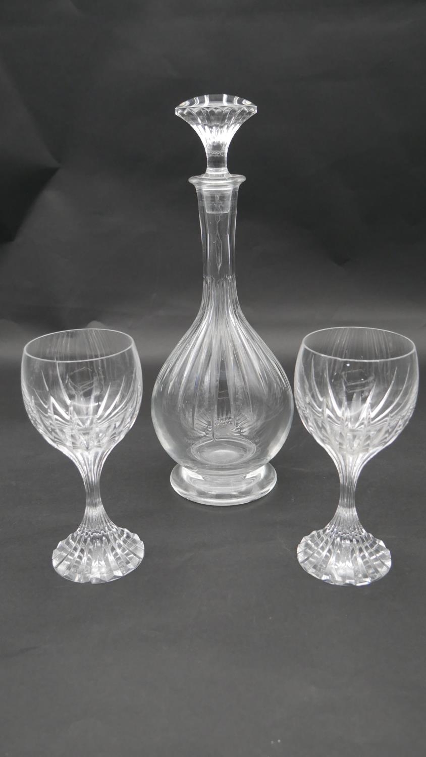 A Baccarat cut crystal decanter with stopper and two 'Massena' Baccarat wine glasses. H.35cm (