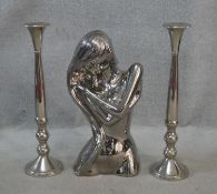 A pair of chrome candlesticks along with a chrome effect ceramic bust of a female figure. H.53cm