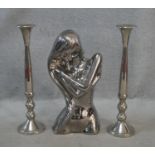 A pair of chrome candlesticks along with a chrome effect ceramic bust of a female figure. H.53cm