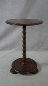 A Victorian mahogany lamp table on bobbin turned column on platform base. H.65 L.43 W.43cm