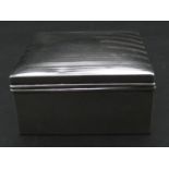 A cedar lined silver cigarette box with linear engine turned decoration. Hallmarked: AZ for A & J