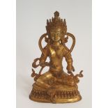 A 19th Tibetan century gilded bronze Buddha sitting on a lotus flower base. H.23xW.15cm