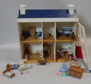 A vintage scratch built doll's house complete with furniture and effects. H.60 L.60 W.24cm