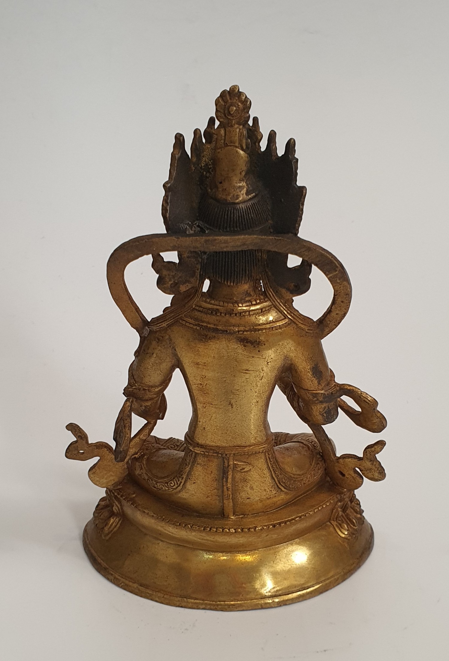 A 19th Tibetan century gilded bronze Buddha sitting on a lotus flower base. H.23xW.15cm - Image 3 of 3