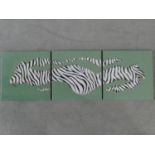 A triptych of three oils on canvas depicting an abstract zebra stripe design, signed Naluyele, 2005.