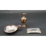 A collection of silver items. Including A miniature silver Grecian style water pitcher, a repousse