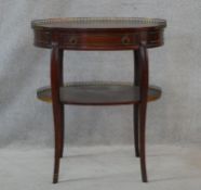 A Louis XV style mahogany lamp table with pierced brass galleried top and frieze drawer on slender