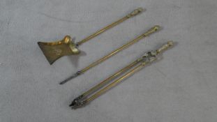 A set of 19th century embossed brass fire irons. L.71.5cm