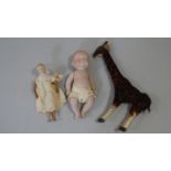Two antique porcelain dolls, one with jointed wooden body, legs and arms and an antique fur