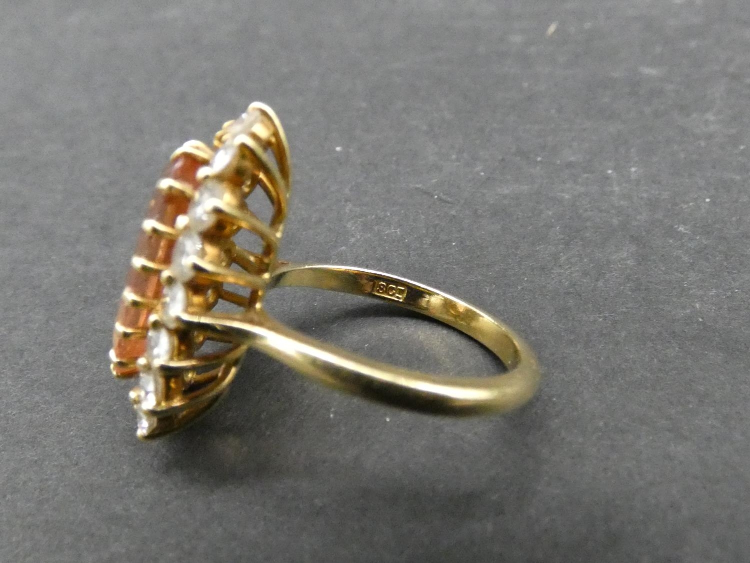 A vintage 18ct yellow gold topaz and diamond oval cluster dress ring. Set with an oval mixed cut - Image 3 of 3